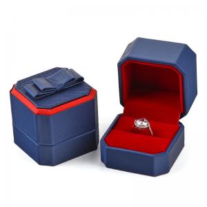 Royal Blue Octagonal Ring Boxes inside Padded with Red Flock with Ribbon Bow Decoration